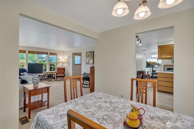 1102 SW 348th Pl, Federal Way, WA 98023 - dining room featuring track lighting and light colored carpet