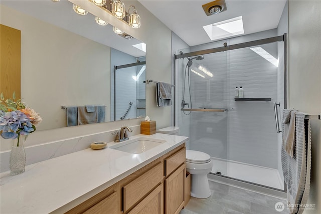 1102 SW 348th Pl, Federal Way, WA 98023 - bathroom featuring a skylight, toilet, vanity, and a shower stall