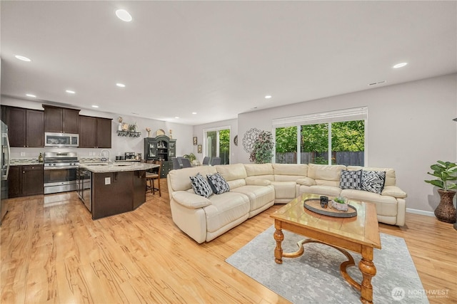 8010 167th Street Ct E, Puyallup, WA 98375 - living room featuring recessed lighting and light wood-style flooring