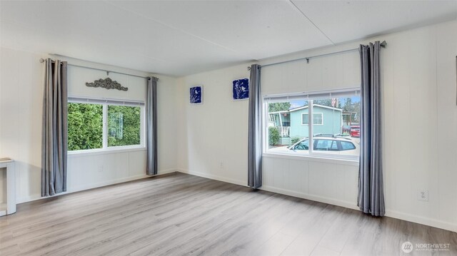 1510 Maple Ln Unit 16, Kent, WA 98030 - spare room with wood finished floors and baseboards