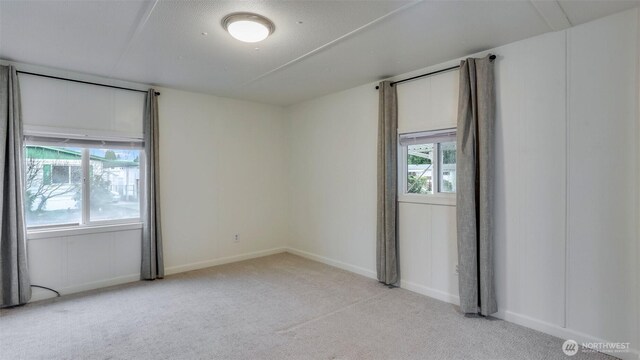 1510 Maple Ln Unit 16, Kent, WA 98030 - unfurnished room with light colored carpet and baseboards