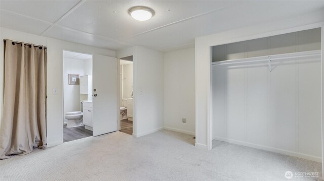 1510 Maple Ln Unit 16, Kent, WA 98030 - unfurnished bedroom with light colored carpet, a closet, ensuite bathroom, and baseboards