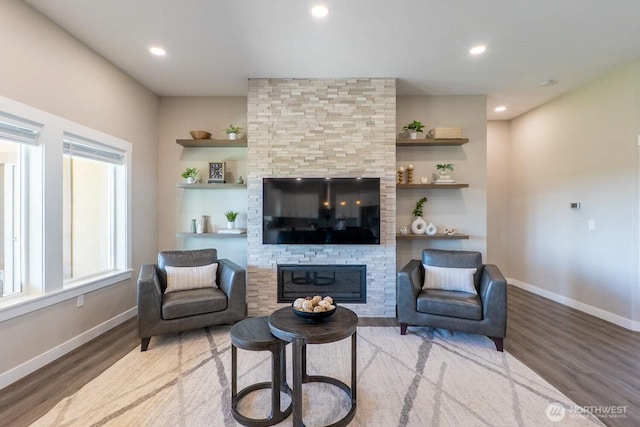 26602 N Rothrock Rd, Prosser, WA 99350 - living area with a fireplace, wood finished floors, recessed lighting, and built in features