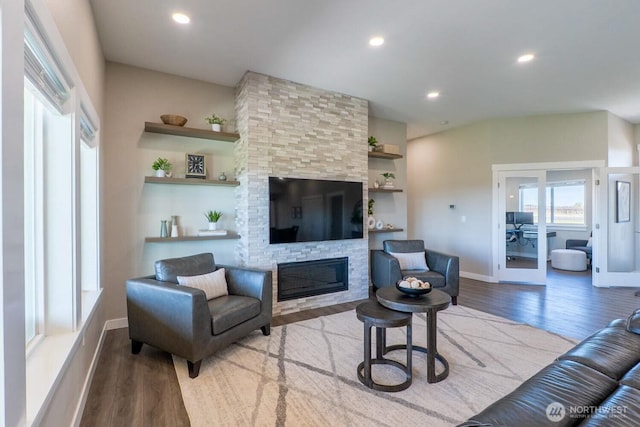 26602 N Rothrock Rd, Prosser, WA 99350 - living area with wood finished floors, a stone fireplace, and recessed lighting