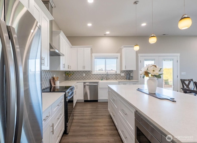 26602 N Rothrock Rd, Prosser, WA 99350 - kitchen featuring appliances with stainless steel finishes, light countertops, white cabinetry, backsplash, and french doors