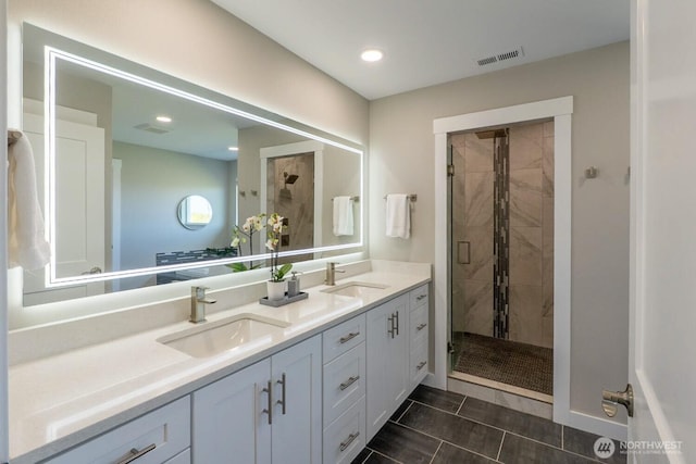 26602 N Rothrock Rd, Prosser, WA 99350 - full bathroom with double vanity, a shower stall, and recessed lighting