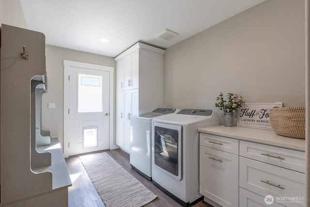 26602 N Rothrock Rd, Prosser, WA 99350 - laundry room with cabinet space, independent washer and dryer, dark wood-style floors, and recessed lighting