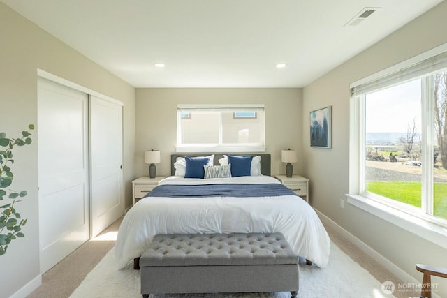 26602 N Rothrock Rd, Prosser, WA 99350 - bedroom with light colored carpet, a closet, and recessed lighting