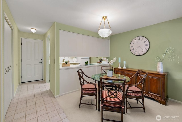 2253 Gilman Dr W Unit 207, Seattle, WA 98119 - dining area with baseboards and light carpet