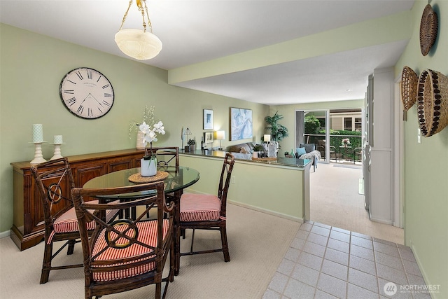 2253 Gilman Dr W Unit 207, Seattle, WA 98119 - dining space featuring light colored carpet and baseboards