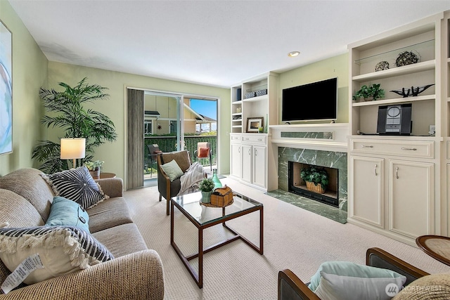 2253 Gilman Dr W Unit 207, Seattle, WA 98119 - carpeted living area with a fireplace, built in features, and recessed lighting