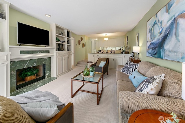 2253 Gilman Dr W Unit 207, Seattle, WA 98119 - living area featuring light carpet, recessed lighting, and a high end fireplace