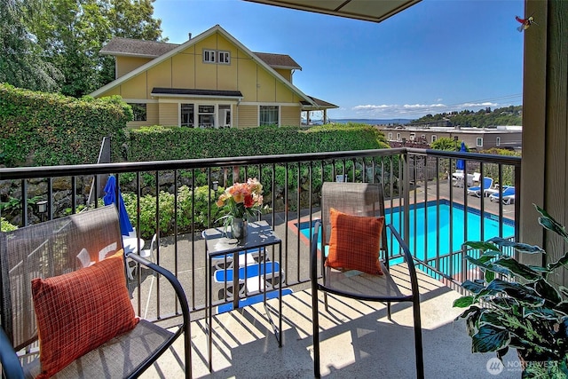 2253 Gilman Dr W Unit 207, Seattle, WA 98119 - balcony featuring view of pool area