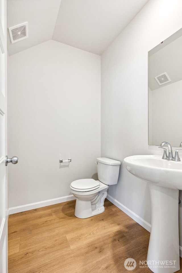 16617 8th Avenue Ct E Unit 9, Spanaway, WA 98387 - half bath featuring wood finished floors and vaulted ceiling
