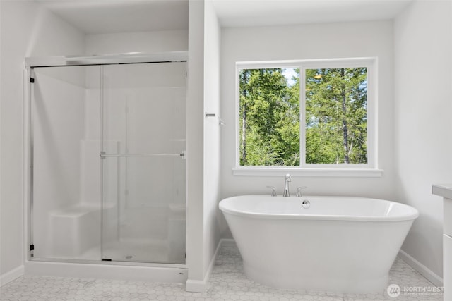 16617 8th Avenue Ct E Unit 9, Spanaway, WA 98387 - bathroom with a shower stall, a soaking tub, and tile patterned floors