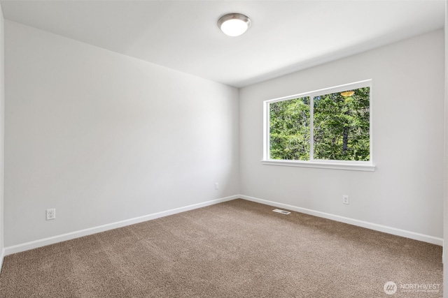 16617 8th Avenue Ct E Unit 9, Spanaway, WA 98387 - carpeted spare room with baseboards