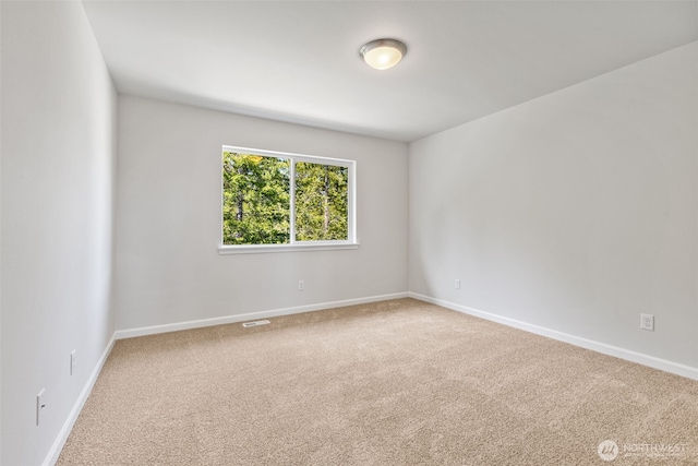 16617 8th Avenue Ct E Unit 9, Spanaway, WA 98387 - carpeted spare room featuring baseboards