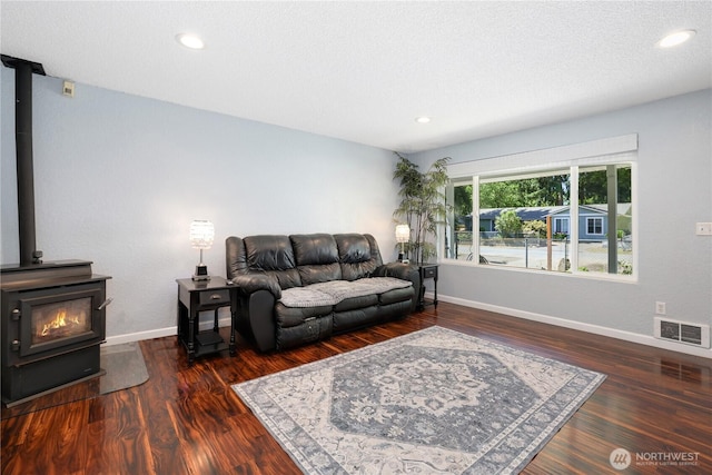 31012 151st Ave SE, Kent, WA 98042 - living area featuring baseboards, wood finished floors, a wood stove, and recessed lighting