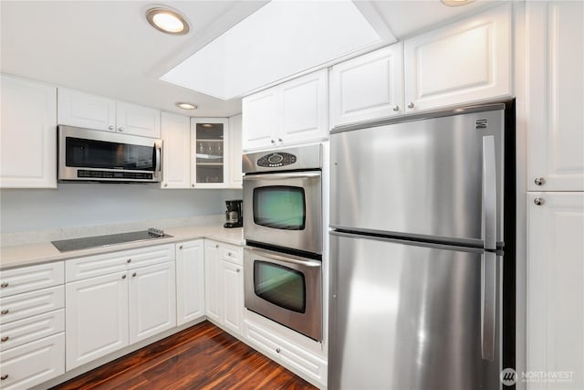 31012 151st Ave SE, Kent, WA 98042 - kitchen with stainless steel appliances, glass insert cabinets, light countertops, dark wood-type flooring, and recessed lighting
