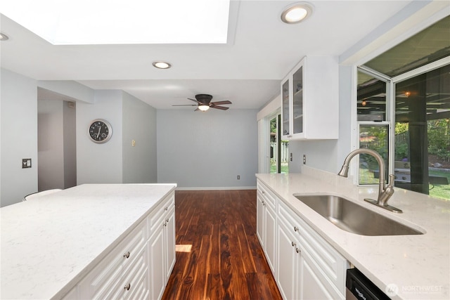31012 151st Ave SE, Kent, WA 98042 - kitchen with a sink, a skylight, light stone counters, dark wood-style flooring, and recessed lighting