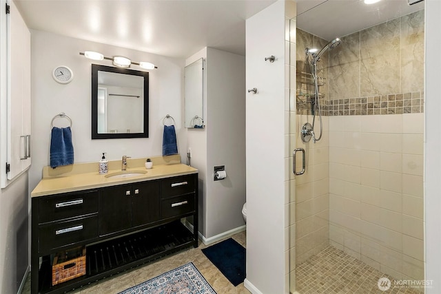 8005 Sand Point Way NE Unit A41, Seattle, WA 98115 - bathroom with a stall shower, vanity, toilet, and baseboards
