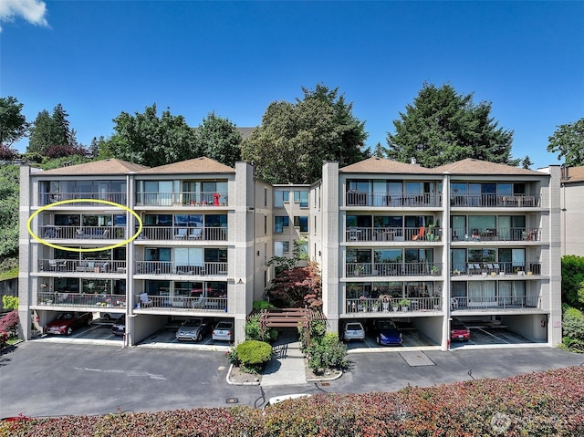 8005 Sand Point Way NE Unit A41, Seattle, WA 98115 - view of apartment building / complex featuring covered parking