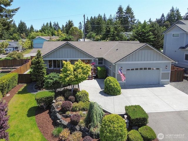 1427 N Aurora Ct, Port Angeles, WA 98363 - ranch-style home featuring an attached garage, board and batten siding, and driveway