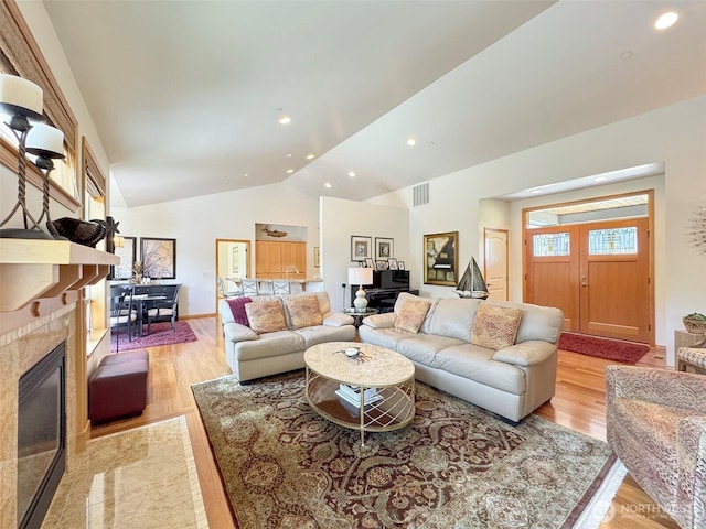 1427 N Aurora Ct, Port Angeles, WA 98363 - living room featuring lofted ceiling, light wood finished floors, a fireplace, recessed lighting, and baseboards