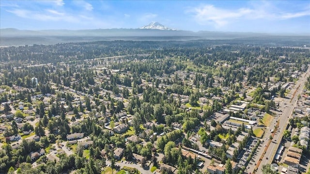 1822S 284th Ln Unit D-104, Federal Way, WA 98003 - aerial view of property and surrounding area with mountains and a forest