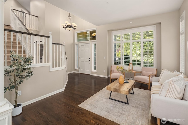 328 210th St SE, Bothell, WA 98021 - living room with stairway, wood finished floors, baseboards, a chandelier, and vaulted ceiling