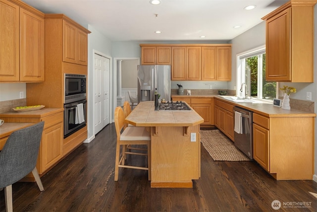 328 210th St SE, Bothell, WA 98021 - kitchen featuring stainless steel appliances, a sink, a kitchen island, dark wood-type flooring, and recessed lighting