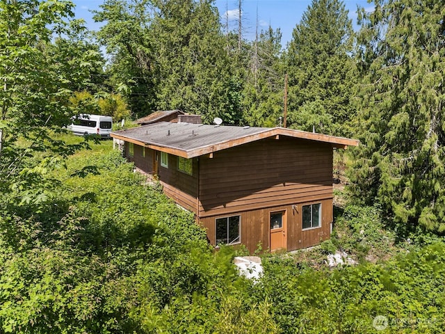 20247 SE 206th St, Maple Valley, WA 98038 - rear view of house featuring a view of trees