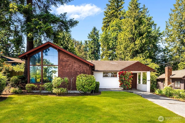 9539 Lake Shore Blvd NE, Seattle, WA 98115 - view of front of house with a front yard, driveway, and an attached carport