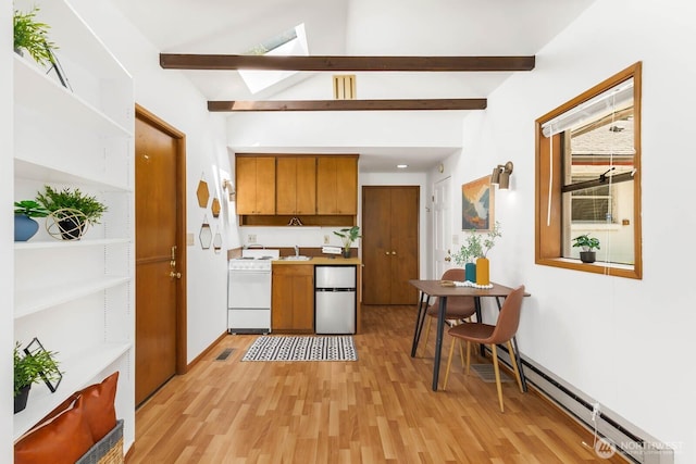 9539 Lake Shore Blvd NE, Seattle, WA 98115 - kitchen featuring freestanding refrigerator, white range, a skylight, brown cabinets, and light wood finished floors