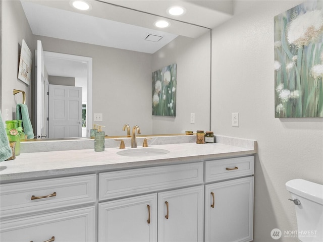 34214 102nd Ave S, Roy, WA 98580 - bathroom featuring toilet, vanity, and recessed lighting