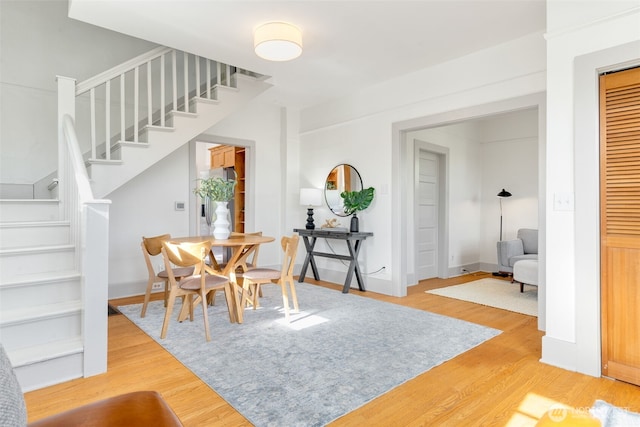 4340S Bennett, Seattle, WA 98118 - dining room with stairway, light wood-style floors, and baseboards