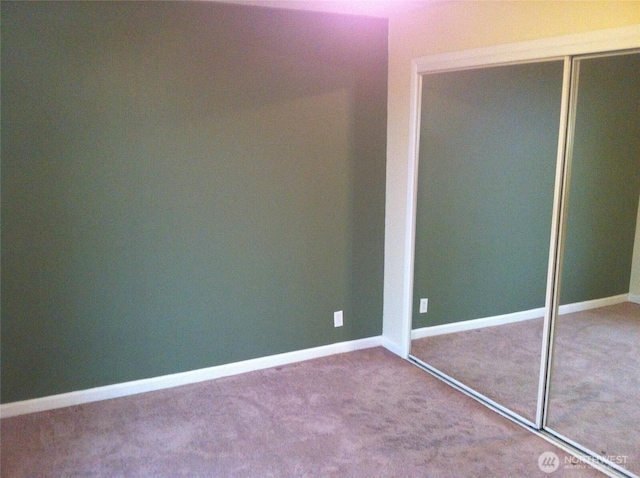 2513 13th Ave W, Seattle, WA 98119 - unfurnished bedroom featuring carpet floors and a closet