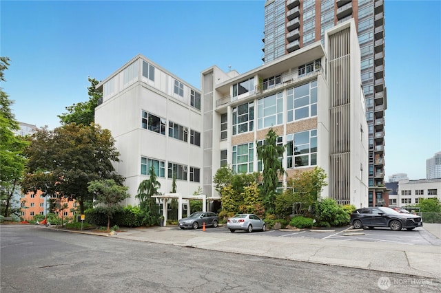 1000 Union St Unit 305, Seattle, WA 98101 - view of apartment building / complex with uncovered parking