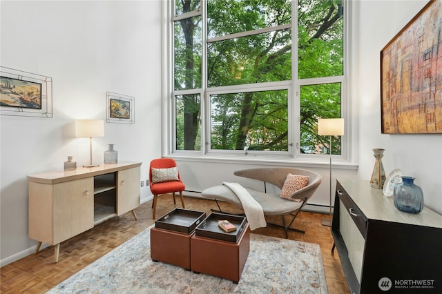 1000 Union St Unit 305, Seattle, WA 98101 - living area with a baseboard radiator and baseboards