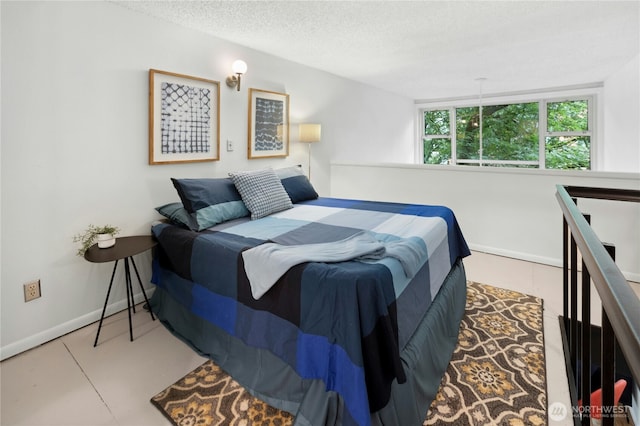1000 Union St Unit 305, Seattle, WA 98101 - bedroom with baseboards and a textured ceiling