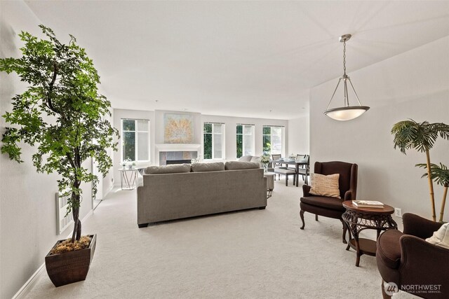 17432 Bothell Way NE Unit B302, Bothell, WA 98011 - living area with light colored carpet and a tile fireplace