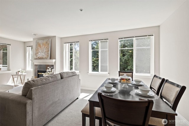 17432 Bothell Way NE Unit B302, Bothell, WA 98011 - dining area featuring plenty of natural light, carpet flooring, and a fireplace