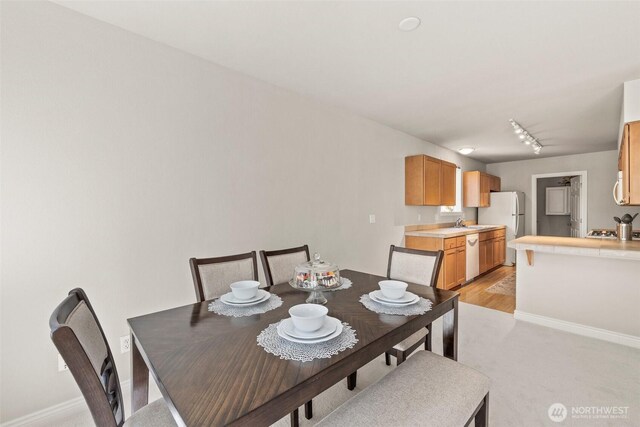 17432 Bothell Way NE Unit B302, Bothell, WA 98011 - dining room featuring track lighting and light carpet