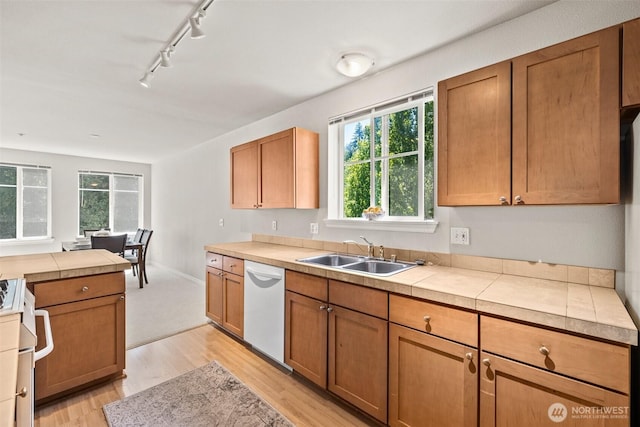17432 Bothell Way NE Unit B302, Bothell, WA 98011 - kitchen featuring dishwasher, stove, track lighting, light wood-style floors, and healthy amount of natural light