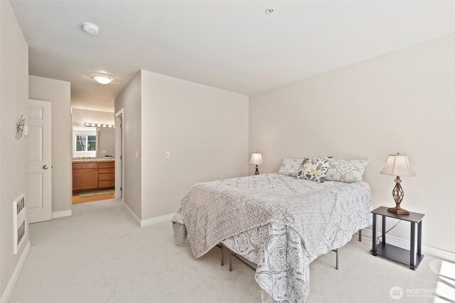 17432 Bothell Way NE Unit B302, Bothell, WA 98011 - bedroom featuring light colored carpet and ensuite bathroom