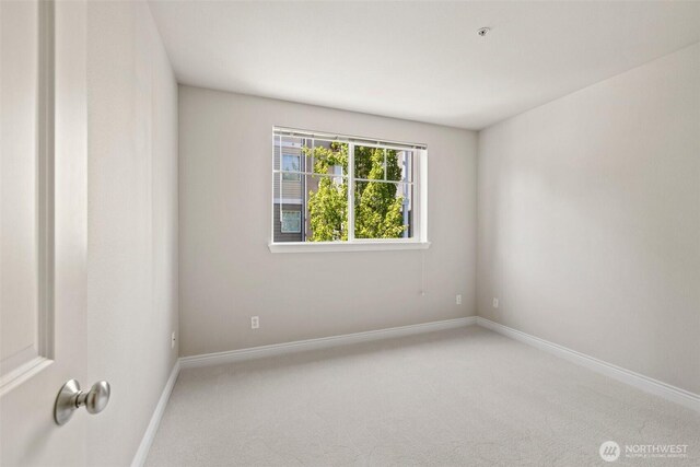17432 Bothell Way NE Unit B302, Bothell, WA 98011 - carpeted spare room with baseboards