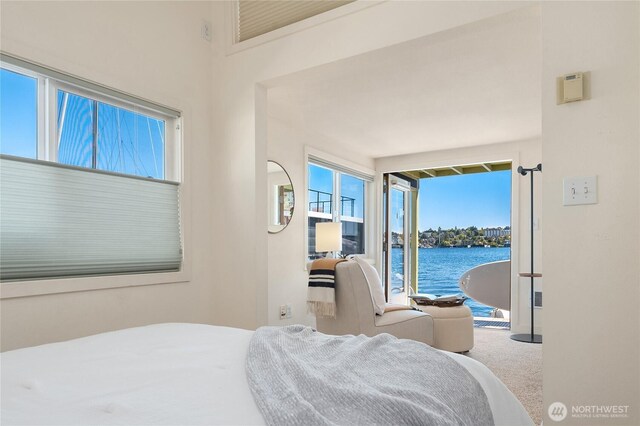 2420 Westlake Ave N Unit 11, Seattle, WA 98109 - carpeted bedroom featuring a water view and access to exterior