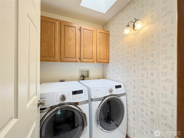 42 Charles Way, Sequim, WA 98382 - laundry area featuring washer and clothes dryer, a skylight, cabinet space, and wallpapered walls