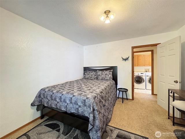 42 Charles Way, Sequim, WA 98382 - bedroom featuring washer and clothes dryer, light colored carpet, a textured ceiling, and baseboards