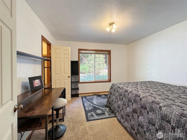 42 Charles Way, Sequim, WA 98382 - bedroom with light colored carpet, a textured ceiling, and a desk